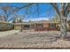 Cozy home featuring brick accents, a well-kept yard, and a lovely shade tree at 273 S 13Th Ave, Brighton, CO 80601