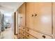 Hallway with wood floors and a large built-in closet with doors and drawers at 273 S 13Th Ave, Brighton, CO 80601
