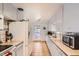 Well-lit kitchen with white cabinetry, updated appliances, and convenient layout at 273 S 13Th Ave, Brighton, CO 80601