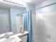 Clean bathroom with light blue vanity and shower/tub at 15475 E Louisiana Ave, Aurora, CO 80017