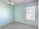 Second bedroom with light teal walls and ceiling fan at 15475 E Louisiana Ave, Aurora, CO 80017