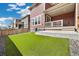 Charming home featuring a well-manicured backyard with an inviting, covered patio area, perfect for outdoor enjoyment at 17848 Gallup St, Broomfield, CO 80023