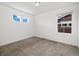 Bright and airy bedroom with carpeted flooring, bright white walls, and large windows for natural light at 17848 Gallup St, Broomfield, CO 80023