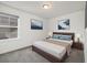 Relaxing bedroom featuring carpeted floors, neutral decor, and large windows for natural light at 17848 Gallup St, Broomfield, CO 80023