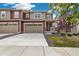 Charming home featuring a two-car garage and well-manicured lawn during daytime at 17848 Gallup St, Broomfield, CO 80023