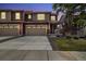 Charming home featuring a two-car garage and well-manicured lawn at twilight at 17848 Gallup St, Broomfield, CO 80023