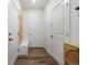 Hallway featuring a bench and coat hooks, providing an organized entryway at 17848 Gallup St, Broomfield, CO 80023