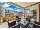Outdoor patio featuring wood flooring, comfortable seating, and a beautiful neighborhood view at 17848 Gallup St, Broomfield, CO 80023