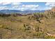 Areal view of home in nature with lush hills and mountain range backdrop at 97 Hedges Cir, Sedalia, CO 80135