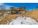 Exterior view of home with an outbuilding and a rock-lined landscape at 97 Hedges Cir, Sedalia, CO 80135