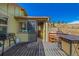 Outdoor deck featuring a grill and dining table, perfect for entertaining and enjoying the view at 97 Hedges Cir, Sedalia, CO 80135