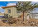 Charming home with a two-car garage, wooden stairs, neutral paint, and a picturesque view of surrounding nature at 97 Hedges Cir, Sedalia, CO 80135