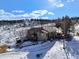 Mountain home with a rustic deck and convenient driveway access. Enjoy mountain living with views and privacy at 97 Hedges Cir, Sedalia, CO 80135
