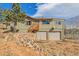 Beautiful home featuring a two-car garage, a wooden staircase, and gorgeous views of the surrounding area at 97 Hedges Cir, Sedalia, CO 80135