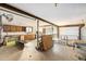 Spacious garage with workbench, storage, and access to the outdoors at 97 Hedges Cir, Sedalia, CO 80135