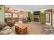 Cozy living room featuring a fireplace, wood ceiling, plush seating, and warm lighting at 97 Hedges Cir, Sedalia, CO 80135