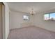 Spacious bedroom with chandelier and window at 13769 Omega Cir, Lone Tree, CO 80124