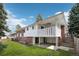 Expansive backyard showcasing the deck and covered patio area at 3089 S Quintero Way, Aurora, CO 80013