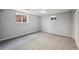 Finished basement with bright windows and plush carpeting, ready for your personal touch at 3089 S Quintero Way, Aurora, CO 80013