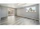 Basement area featuring modern flooring, a window, and a sliding door leading to the patio at 3089 S Quintero Way, Aurora, CO 80013