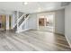 Finished basement area with stylish floors, ample lighting, and sliding door access to the yard at 3089 S Quintero Way, Aurora, CO 80013