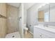 Bathroom features tiled shower, modern vanity and tile flooring at 3089 S Quintero Way, Aurora, CO 80013