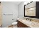 Updated bathroom with granite vanity, decorative mirror and tiled shower at 3089 S Quintero Way, Aurora, CO 80013