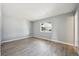 Bright bedroom with large window and new gray flooring at 3089 S Quintero Way, Aurora, CO 80013