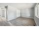 Bright bedroom with closet and large window with new flooring at 3089 S Quintero Way, Aurora, CO 80013