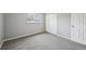 Cozy bedroom with soft carpeting, a window providing natural light, and a closet at 3089 S Quintero Way, Aurora, CO 80013