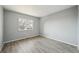 A clean bedroom with grey walls and modern grey flooring at 3089 S Quintero Way, Aurora, CO 80013