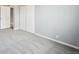 Bright bedroom featuring plush carpets, light walls, and an open closet at 3089 S Quintero Way, Aurora, CO 80013