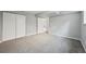 Upstairs bedroom featuring neutral carpet, paint and large closet at 3089 S Quintero Way, Aurora, CO 80013
