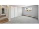 Bedroom featuring plush carpeting, a window, and a closet, providing comfort and storage at 3089 S Quintero Way, Aurora, CO 80013