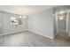 Bright dining room with chandelier and large window with new flooring at 3089 S Quintero Way, Aurora, CO 80013