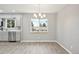 Dining area featuring modern chandelier and large window at 3089 S Quintero Way, Aurora, CO 80013