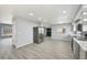 Kitchen with stainless fridge, updated appliances, and view into the living area at 3089 S Quintero Way, Aurora, CO 80013