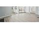 Bright living room with modern flooring, fireplace and sliding doors to the patio at 3089 S Quintero Way, Aurora, CO 80013