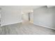 Spacious open floor plan with new gray flooring and freshly painted walls at 3089 S Quintero Way, Aurora, CO 80013
