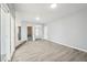 Bright living room featuring neutral walls, and wood-look flooring at 3089 S Quintero Way, Aurora, CO 80013