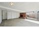 Covered patio with red brick fireplace and white sliding storage doors at 3089 S Quintero Way, Aurora, CO 80013