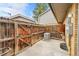 A fenced private backyard with a concrete patio area, ideal for relaxing or entertaining guests at 1557 S Owens St # 59, Denver, CO 80232