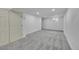 Carpeted basement area featuring white walls, with recessed lighting and a small basement window at 1557 S Owens St # 59, Denver, CO 80232