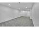 Basement featuring gray carpet, white walls and trim, and recessed lighting at 1557 S Owens St # 59, Denver, CO 80232