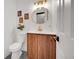 Stylish powder room with modern vanity, decorative mirror, and sleek fixtures at 1557 S Owens St # 59, Denver, CO 80232
