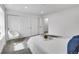 Spacious bedroom featuring plush carpet, white walls, and ample closet space for storage at 1557 S Owens St # 59, Denver, CO 80232