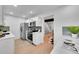 Bright kitchen boasts white cabinets, stainless steel appliances, and designer backsplash at 1557 S Owens St # 59, Denver, CO 80232