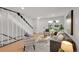 Inviting living room with staircase, neutral decor, and a view of the outdoors at 1557 S Owens St # 59, Denver, CO 80232