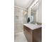 Modern bathroom featuring a glass-enclosed shower, stylish vanity, and tile accents for a spa-like experience at 4557 Stuart St, Denver, CO 80212