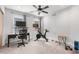 Bright flex-space bedroom featuring a ceiling fan, carpeted floors, and two windows at 4557 Stuart St, Denver, CO 80212